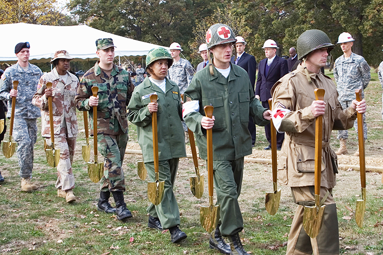 Groundbreaking ceremony, military members with shovels photo